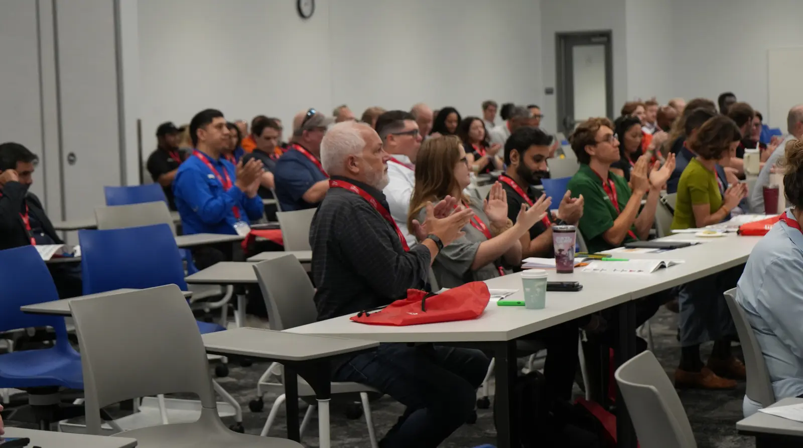 Conference attendees applauding during the AI in the Construction Workplace session at the ABC EdTech Summit